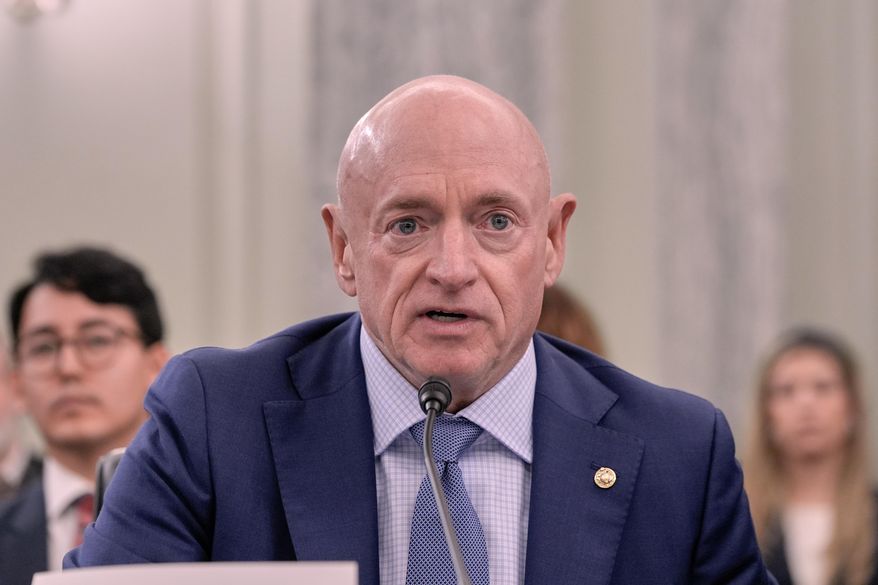 Sen. Mark Kelly, D-Ariz., speaks during a Senate Commerce, Science, Transportation nominations hearing, on Capitol Hill, Wednesday, Oct. 22, 2025, in Washington. (AP Photo/Mariam Zuhaib)