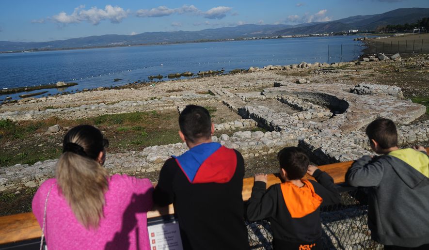 Visitors look at archaeological excavations of the ancient Byzantine-era Christian Saint Neophytos Basilica, in Iznik, also known by its ancient name Nicaea, northwestern Turkey, Thursday, Nov. 13, 2025, ahead of the visit of Pope Leo XIV to mark the 1,700th anniversary of the First Council of Nicaea. (AP Photo/Francisco Seco)