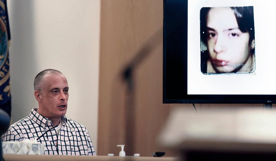 FILE - Youth Development Center. plaintiff David Meehan testifies as his intake photo, when he was 14 is displayed during his civil trial at Rockingham County Superior Court in Brentwood, N.H. on April 17, 2024. (David Lane/Union Leader via AP, Pool, file)