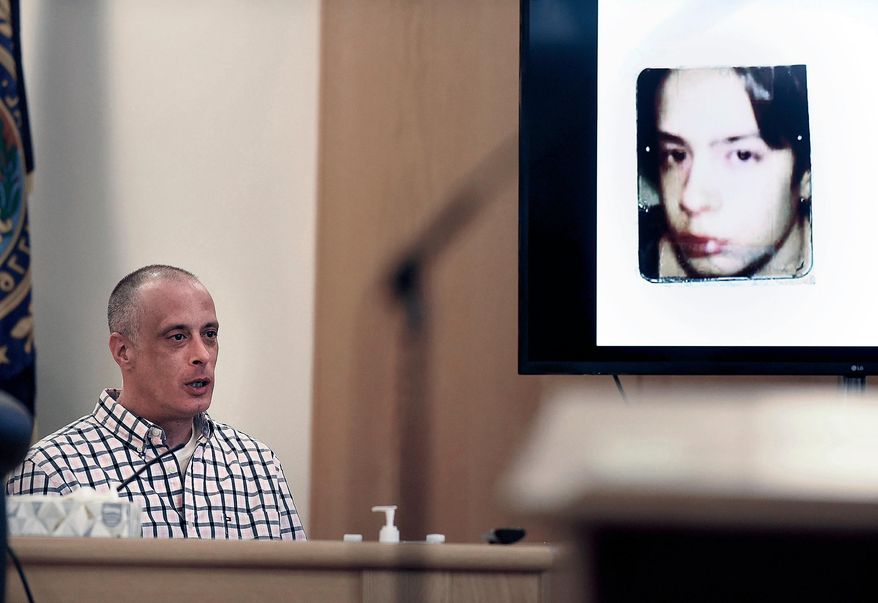 FILE - Youth Development Center. plaintiff David Meehan testifies as his intake photo, when he was 14 is displayed during his civil trial at Rockingham County Superior Court in Brentwood, N.H. on April 17, 2024. (David Lane/Union Leader via AP, Pool, file)