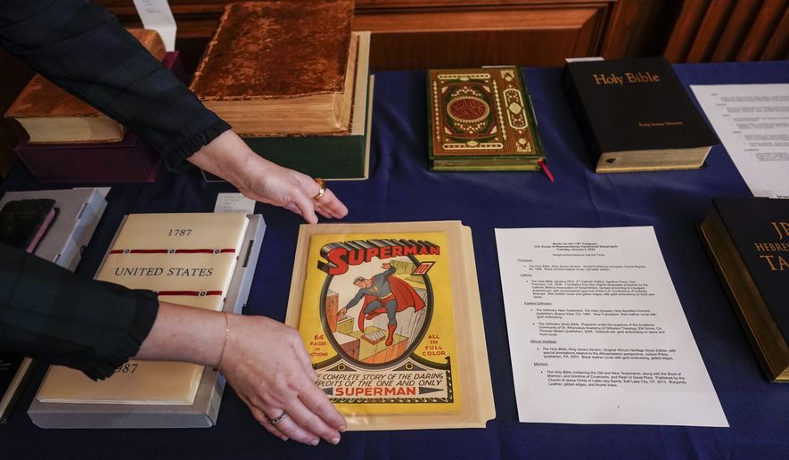 A first edition Superman comic from 1939 is placed with copies of the Constitution and a variety of holy books for use in the swearing-in ceremonies of new House members, at the Capitol in Washington, Tuesday, Jan. 3, 2023, opening day of the 118th Congress. (AP Photo/J. Scott Applewhite)