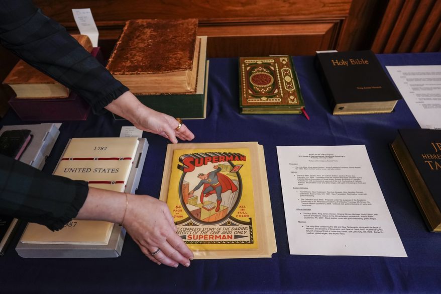 A first edition Superman comic from 1939 is placed with copies of the Constitution and a variety of holy books for use in the swearing-in ceremonies of new House members, at the Capitol in Washington, Tuesday, Jan. 3, 2023, opening day of the 118th Congress. (AP Photo/J. Scott Applewhite)