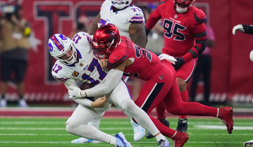 Buffalo Bills quarterback Josh Allen (17) is sacked by Houston Texans linebacker Henry To'oTo'o (39) in the second half of an NFL football game Thursday, Nov. 20, 2025, in Houston. (AP Photo/Ashley Landis)