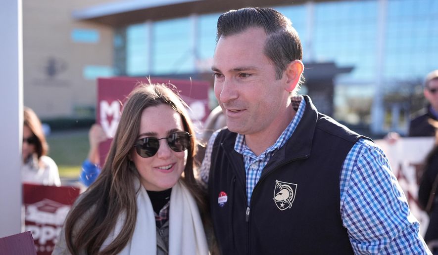 Republican congressional candidate Matt Van Epps, right, hugs a supporter during a campaign event in the special election for the 7th District Wednesday, Nov. 12, 2025, in Nashville, Tenn. (AP Photo/George Walker IV)