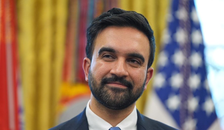 New York City Mayor-elect Zohran Mamdani listens as President Donald Trump speaks in the Oval Office of the White House, Friday, Nov. 21, 2025, in Washington. (AP Photo/Evan Vucci)