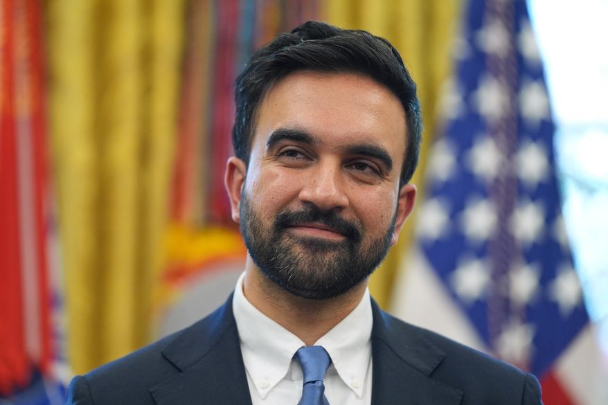 New York City Mayor-elect Zohran Mamdani listens as President Donald Trump speaks in the Oval Office of the White House, Friday, Nov. 21, 2025, in Washington. (AP Photo/Evan Vucci)