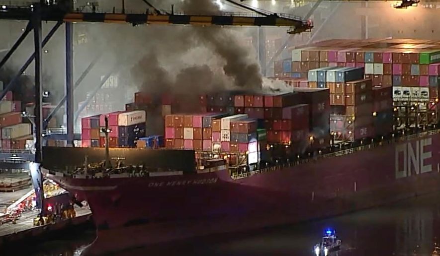 This image taken from video provided by ABC7 shows smoke rising from a blaze on a container ship docked at the Port of Los Angeles, Friday, Nov. 21, 2025, in Los Angeles. (ABC7 via AP)