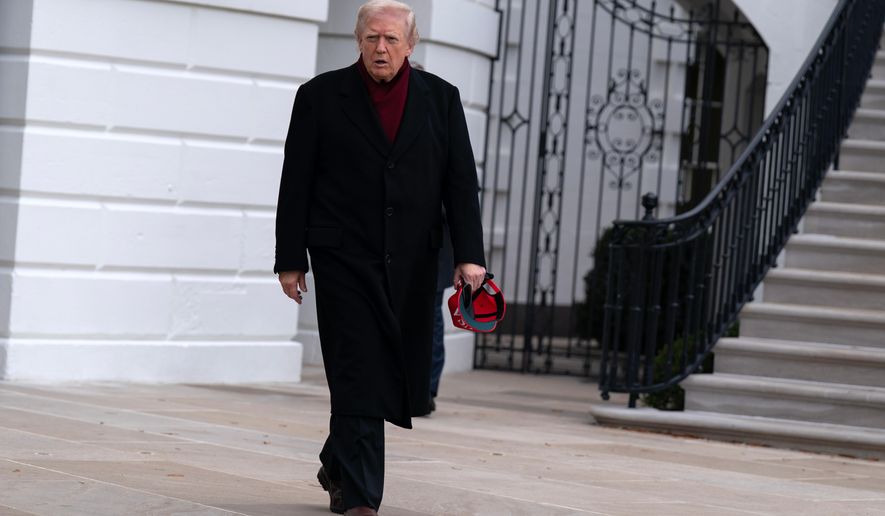 President Donald Trump walks towards reporters from the South Lawn of the White House, Saturday, Nov. 22, 2025, in Washington, en route to Joint Base Andrews. (AP Photo/Jose Luis Magana)