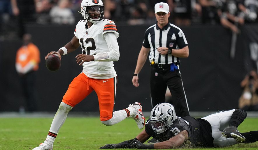 Las Vegas Raiders defensive end Tyree Wilson (9) pressures Cleveland Browns quarterback Shedeur Sanders (12) during the first half of an NFL football game Sunday, Nov. 23, 2025, in Las Vegas. (AP Photo/Eric Gay)