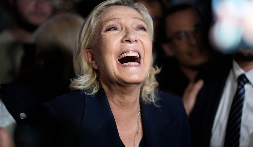 French far-right leader Marine Le Pen reacts as she meets supporters and journalists after the release of projections based on the actual vote count in select constituencies , Sunday, June 30, 2024 in Henin-Beaumont, northern France. (AP Photo/Thibault Camus, File)