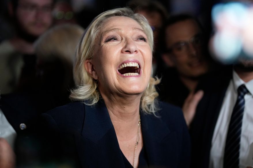 French far-right leader Marine Le Pen reacts as she meets supporters and journalists after the release of projections based on the actual vote count in select constituencies , Sunday, June 30, 2024 in Henin-Beaumont, northern France. (AP Photo/Thibault Camus, File)