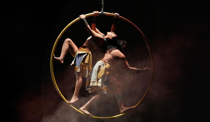 Acrobats from a Mexican theater company perform the show titled "Mortal Leap into Xibalba," which reinterprets a myth from a sacred Mayan book about creation and the journey to the underworld, in Mexico City, Saturday, Nov. 22, 2025. (AP Photo/Marco Ugarte)
