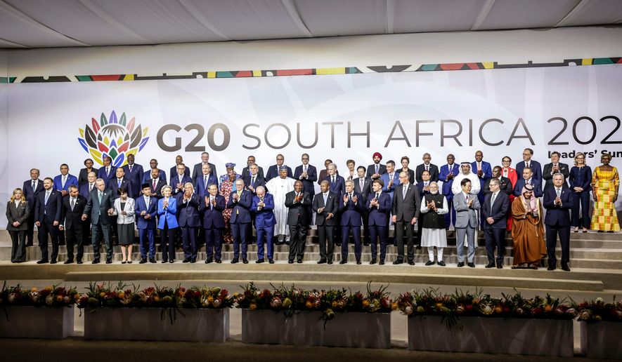 Leaders and delegates pose for a group photo, on the opening day of the G20 Leaders' Summit, in Johannesburg, South Africa, Saturday, Nov. 22, 2025. (Gianluigi Guercia/Pool Photo via AP)