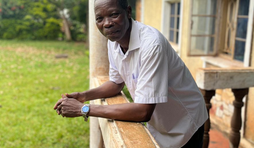 Moses Kutoi, a clan leader of the Bagisu people in eastern Uganda, stands on the balcony of his house in Nabumali, Mbale, Uganda, Wednesday, Nov. 19, 2025. (AP Photo/Rodney Muhumuza)