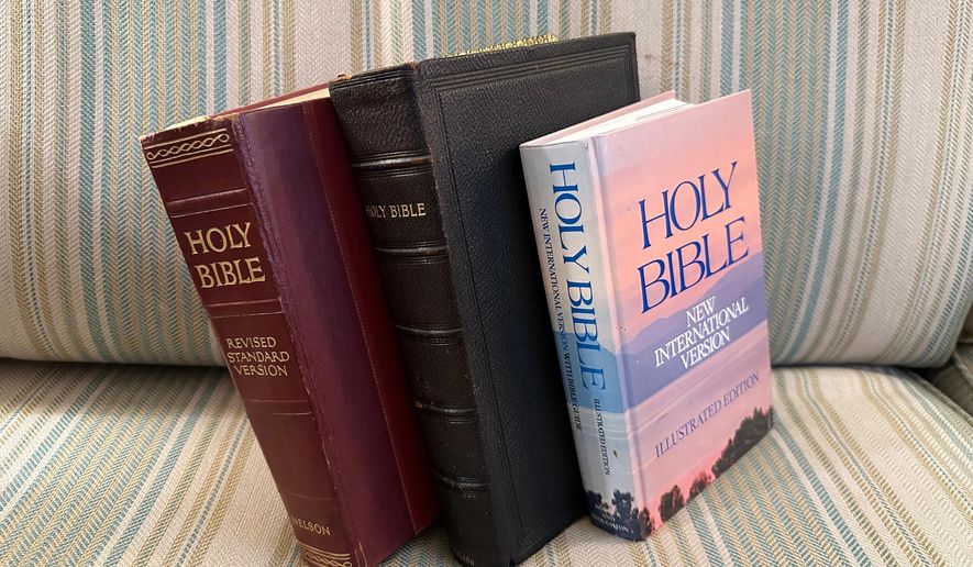 Three bibles sit on a couch Monday, Nov. 24, 2025, in Brooklyn, New York. (AP Photo/David Crary)