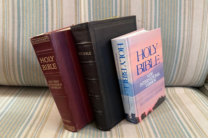 Three bibles sit on a couch Monday, Nov. 24, 2025, in Brooklyn, New York. (AP Photo/David Crary)