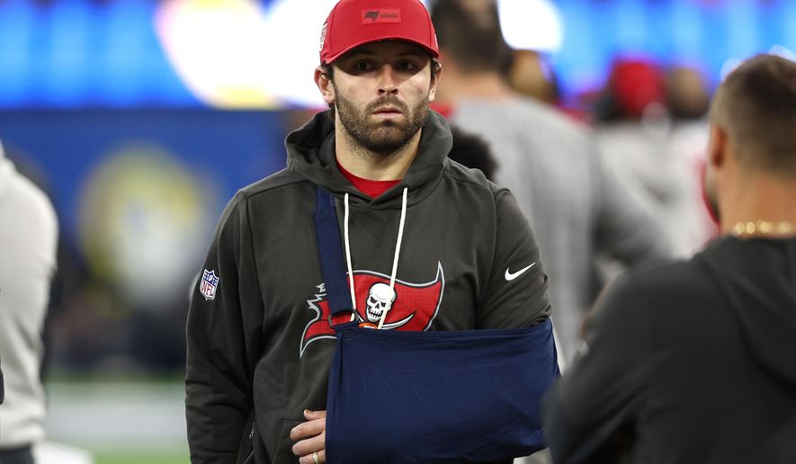 Tampa Bay Buccaneers quarterback Baker Mayfield (6) looks on from the sidelines wearing a sling during the second half against the Los Angeles Rams in an NFL football game Sunday, Nov. 23, 2025, in Inglewood, Calif. (AP Photo/Jessie Alcheh)