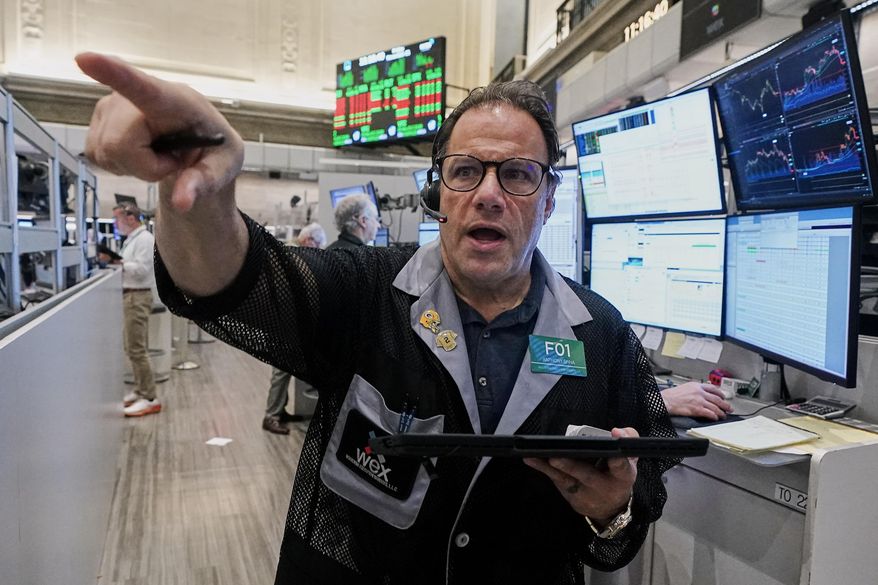 Options trader Anthony Spina works on the floor of the New York Stock Exchange, Friday, Nov. 21, 2025. (AP Photo/Richard Drew)