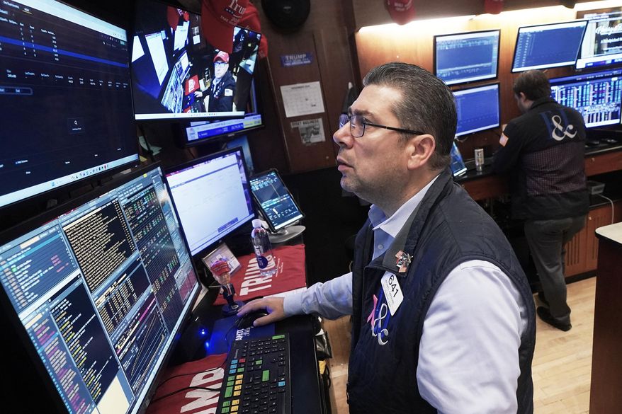 Trader Michael Capolino works on the floor of the New York Stock Exchange, Monday, Nov. 24, 2025. (AP Photo/Richard Drew)