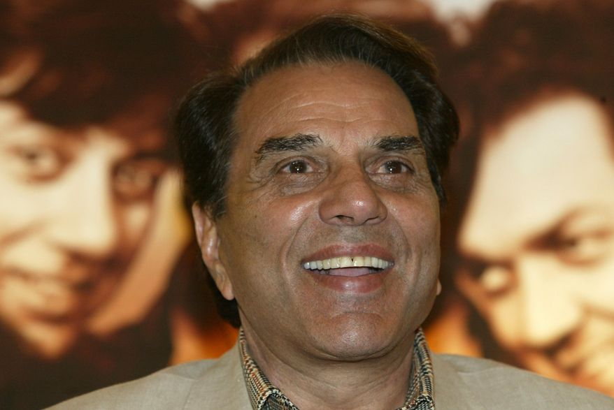 FILE - Bollywood actor and Indian lawmaker Dharmendra reacts during a promotional press conference of his latest film "Apne" in Calcutta, India, Monday, June 25, 2007. (AP Photo/Bikas Das, File)