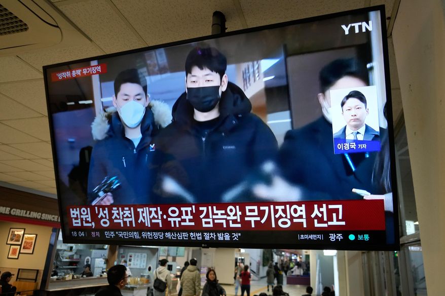 A TV screen shows a file image of Kim Nok-wan, center, the leader of a Telegram- based sex crime ring, during a news program at a express bus terminal in Seoul, South Korea, Monday, Nov. 24, 2025. The words on screen read: "Court sentences Kim Nok-wan to life imprisonment for sexual exploitation, production and distribution." (AP Photo/Ahn Young-joon)