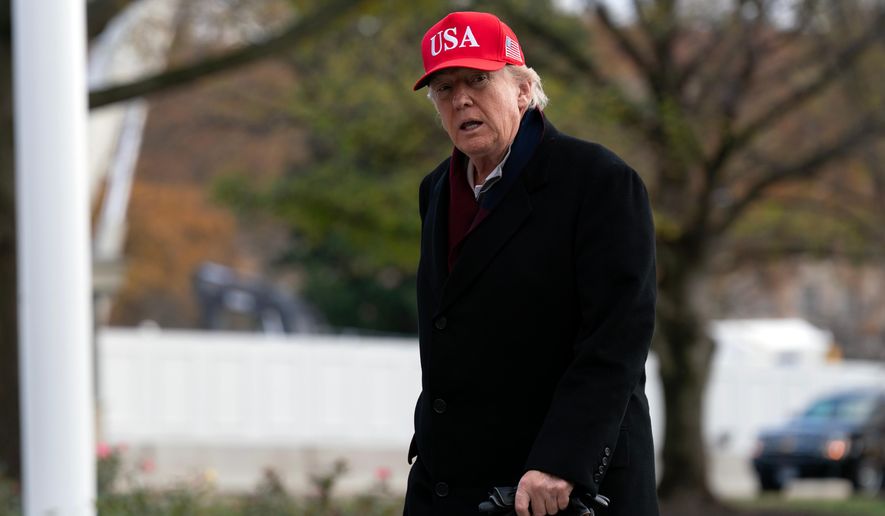 President Donald Trump walks in the South Lawn upon his arrival to the White House in Washington on Saturday, Nov. 22, 2025. (AP Photo/Jose Luis Magana)