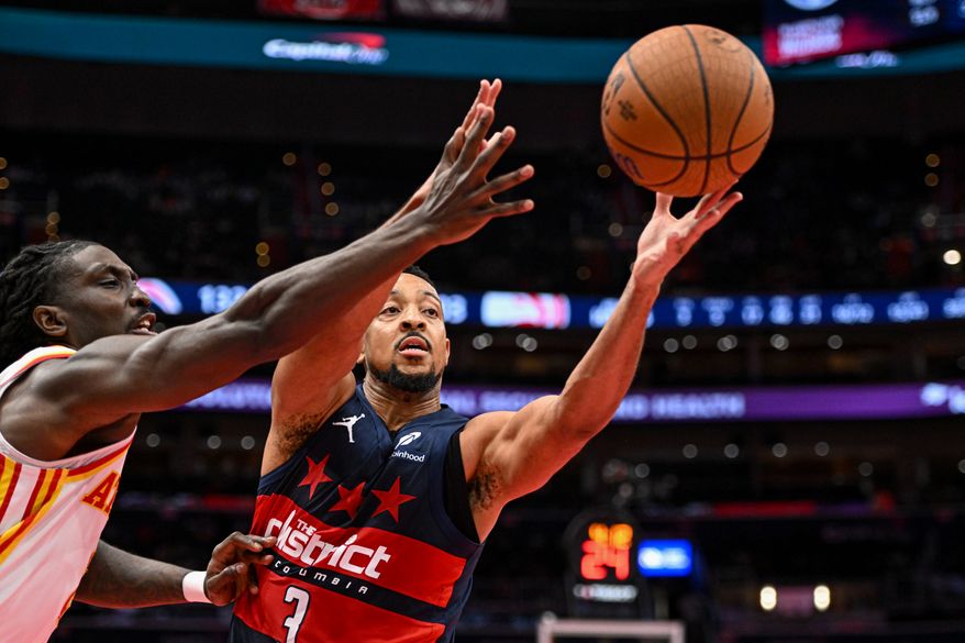 Washington Wizards guard CJ McCollum (3) reaching for a loose ball during the fourth quarter of an NBA game against the Atlanta Hawks at Capital One Arena in Washington D.C., November 25, 2025. (Photo for the Washington Times)