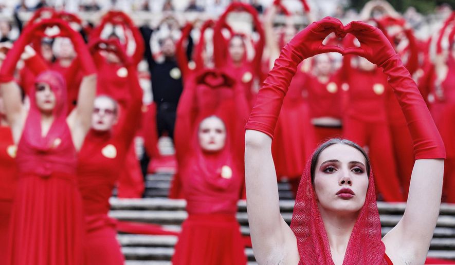 Activists perform on the occasion of the International Day for the Elimination of Violence against Women, in Rome, Tuesday, Nov. 25, 2025 (Roberto Monaldo/LaPresse via AP)