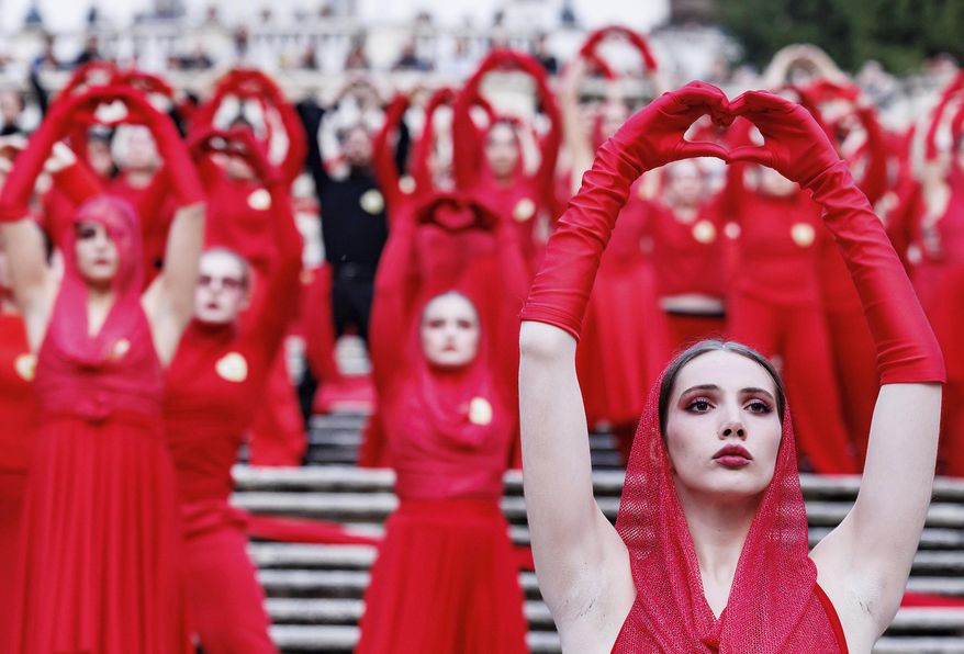Activists perform on the occasion of the International Day for the Elimination of Violence against Women, in Rome, Tuesday, Nov. 25, 2025 (Roberto Monaldo/LaPresse via AP)