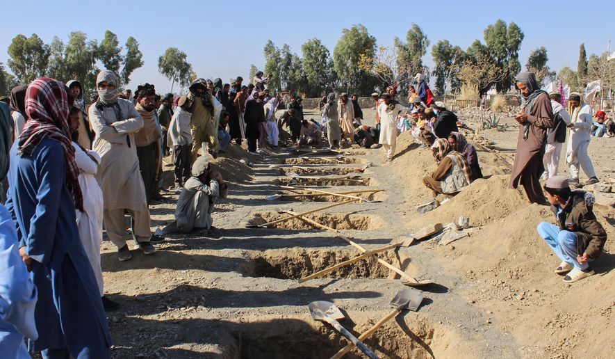 Locals prepare graves for victims of an overnight attack on a home that, according to an Afghan government spokesman, was carried out by Pakistan, in the Gurbaz district of Khost province, Afghanistan, Tuesday, Nov. 25, 2025. (AP Photo/Saifullah Zahir)