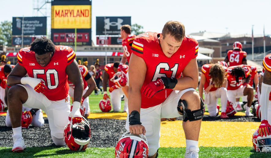Maryland center Michael Hershey (61) takes a knee before the Terrapins NCAA football game against Towson Saturday, Sept. 13, 2025, at SECU Stadium in College Park, Md. (All-Pro Reels)