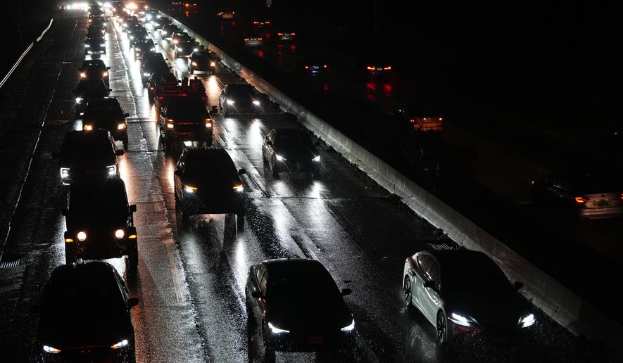 Cars drive on the Baltimore/Washington Parkway as seen from an overpass in Halethorpe, Md., Tuesday, Nov. 25, 2025. (AP Photo/Stephanie Scarbrough)