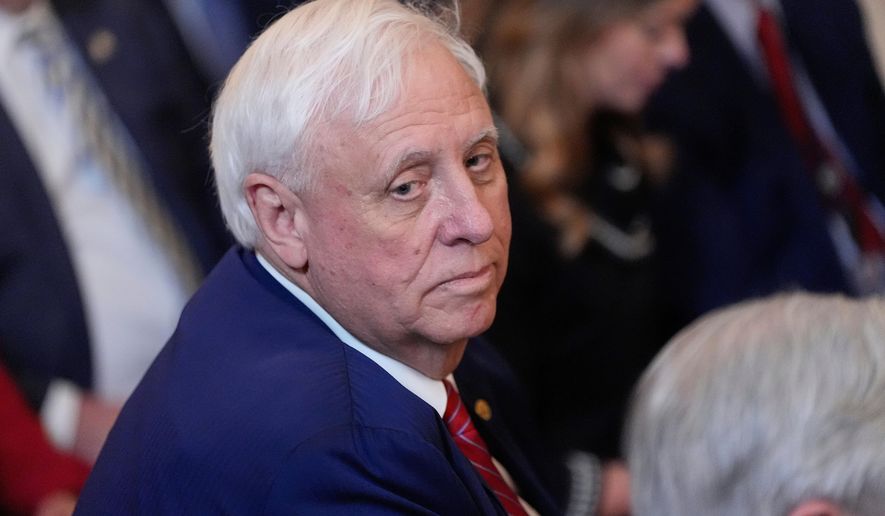 Sen. Jim Justice, R-W.Va., listens as President Donald Trump speaks during an event on energy production in the East Room of the White House, April 8, 2025, in Washington. (AP Photo/Alex Brandon, File)