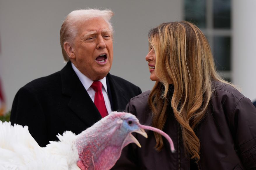 President Donald Trump and first lady Melania Trump, stand next to national Thanksgiving turkey Gobble during a pardoning ceremony in the Rose Garden of the White House, Tuesday, Nov. 25, 2025, in Washington. (AP Photo/Julia Demaree Nikhinson)