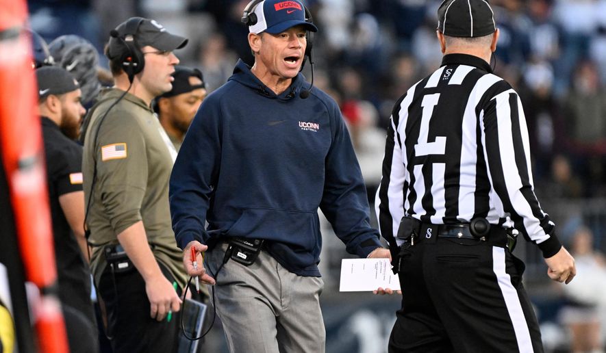 UConn head coach Jim Mora talks with an official during the first half of an NCAA college football game against Duke, Saturday, Nov. 8, 2025, in East Hartford, Conn. (AP Photo/Jessica Hill)