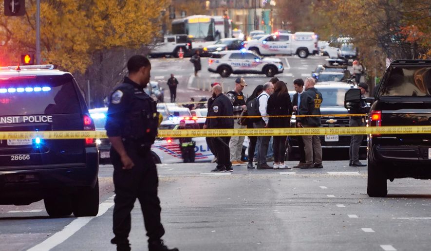 Streets are blocked after reports that two National Guard soldiers were shot near the White House in Washington, Wednesday, Nov. 26, 2025. (AP Photo/Anthony Peltier)