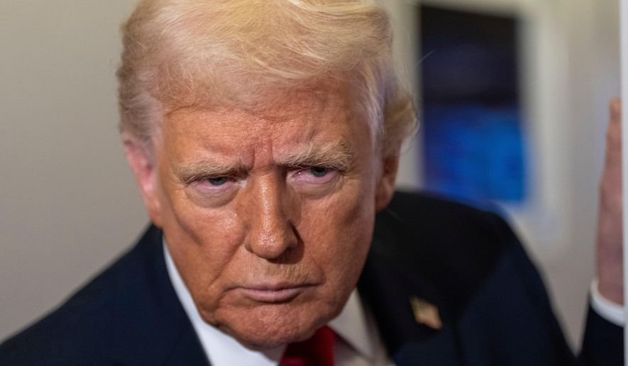 President Donald Trump leans in to hear a question as he speaks with reporters while in flight on Air Force One from Joint Base Andrews to his Mar-a-Lago estate in Palm Beach, Fla., Tuesday, Nov. 25, 2025. (AP Photo/Alex Brandon)