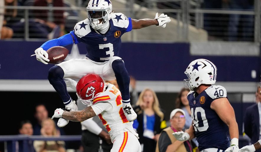 Dallas Cowboys wide receiver George Pickens (3) leaps over Kansas City Chiefs cornerback Trent McDuffie (22) during the second half of an NFL football game Thursday, Nov. 27, 2025, in Arlington, Texas. (AP Photo/Tony Gutierrez)