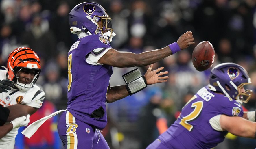 Baltimore Ravens quarterback Lamar Jackson (8) fumbles the ball during the first half of an NFL football game against the Cincinnati Bengals, Thursday, Nov. 27, 2025, in Baltimore. (AP Photo/Stephanie Scarbrough)
