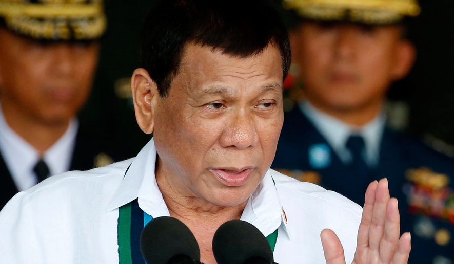 FILE - Philippine President Rodrigo Duterte addresses the troops during the 82nd anniversary celebration of the Armed Forces of the Philippines in suburban Quezon city northeast of Manila, Philippines on Dec. 20, 2017. (AP Photo/Bullit Marquez, File)