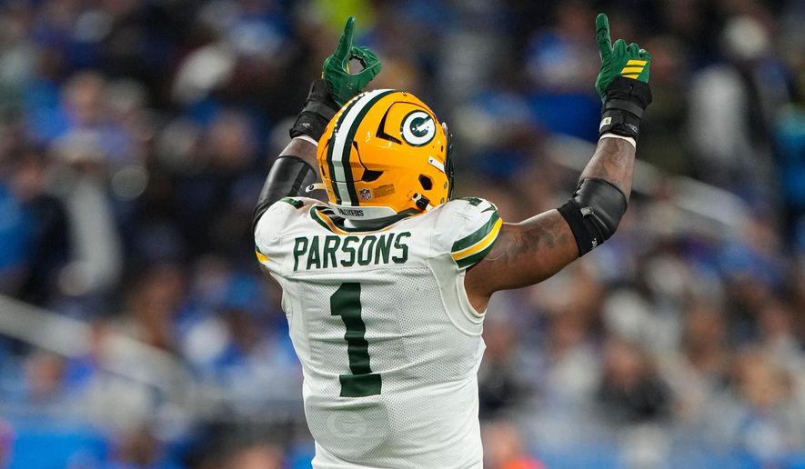 Green Bay Packers defensive lineman Micah Parsons (1) celebrates a sack against the Detroit Lions during the second half an NFL football game in Detroit, Thursday, Nov. 27, 2025. (AP Photo/Ryan Sun)