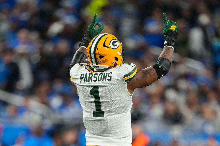 Green Bay Packers defensive lineman Micah Parsons (1) celebrates a sack against the Detroit Lions during the second half an NFL football game in Detroit, Thursday, Nov. 27, 2025. (AP Photo/Ryan Sun)