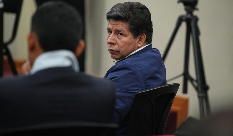 Former President Pedro Castillo, who faces charges of rebellion and other crimes against the state, attends his sentence hearing at a police base on the outskirts of Lima, Peru, Thursday, Nov. 27, 2025. (AP Photo/Guadalupe Pardo)