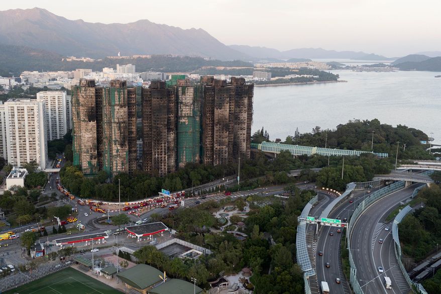 An aerial view of the burnt buildings after a deadly fire that started Wednesday at Wang Fuk Court, a residential estate in the Tai Po district of Hong Kong's New Territories, Friday, Nov. 28, 2025. (AP Photo/Ng Han Guan)