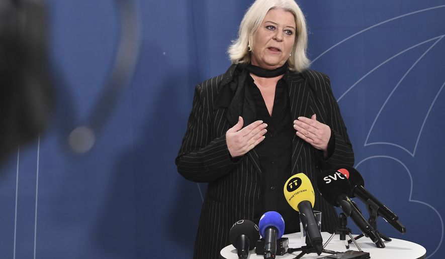 Minister of Social Services Camilla Waltersson Grönvall meets the media after meeting with e-commerce companies, children's rights organizations and authorities following the high-profile reporting on sex dolls depicting children, in Stockholm, Friday, Nov. 28, 2025. (Lars Schröder/TT News Agency via AP)
