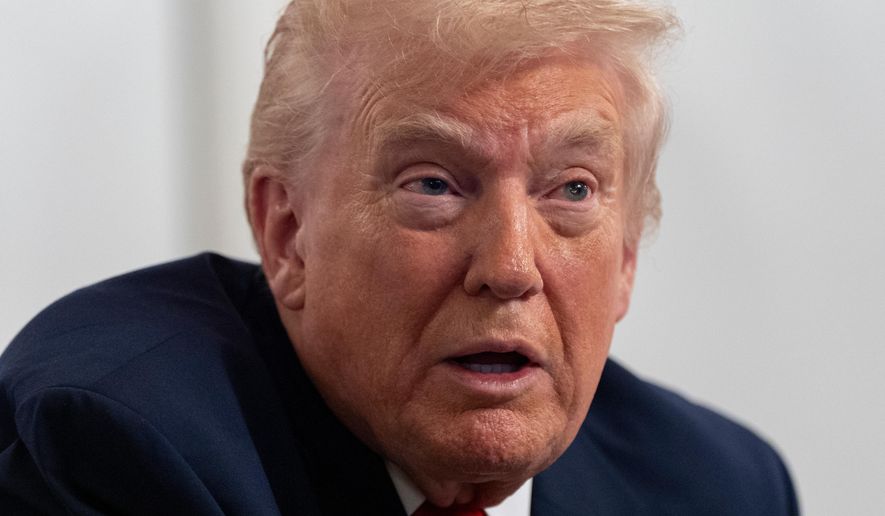 President Donald Trump speaks to reporters after speaking to troops via video from his Mar-a-Lago estate on Thanksgiving, Thursday, Nov. 27, 2025, in Palm Beach, Fla. (AP Photo/Alex Brandon)