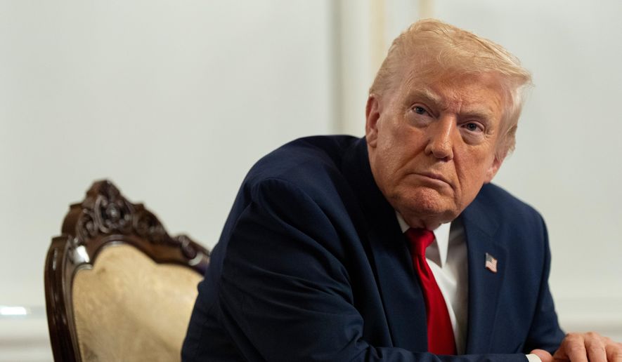 President Donald Trump speaks to reporters after speaking to troops via video from his Mar-a-Lago estate on Thanksgiving, Thursday, Nov. 27, 2025, in Palm Beach, Fla. (AP Photo/Alex Brandon)