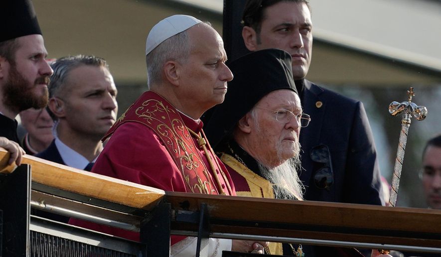 Pope Leo XIV, left, and Ecumenical Patriarch Bartholomew I, the spiritual leader of the world's Eastern Orthodox Christians arrive for an Ecumenical prayer service at archaeological excavations of the ancient Byzantine-era Christian Saint Neophytos Basilica, in Iznik, Turkey, Friday, Nov. 28, 2025, marking the 1,700 years anniversary of the Council of Nicaea. (AP Photo/Khalil Hamra)