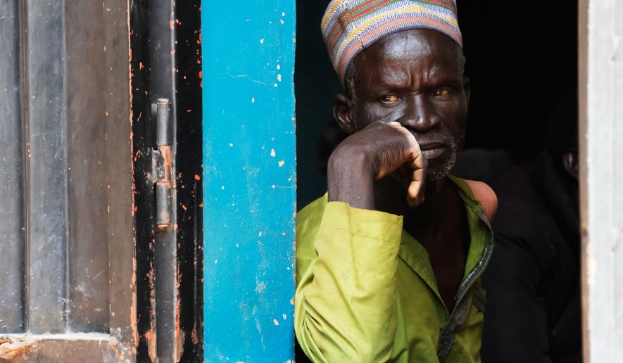A worried parent of abducted school children looks on at St. Mary's Catholic Primary and Secondary School in Papiri community, Nigeria, Friday, Nov. 28, 2025. (AP Photo )