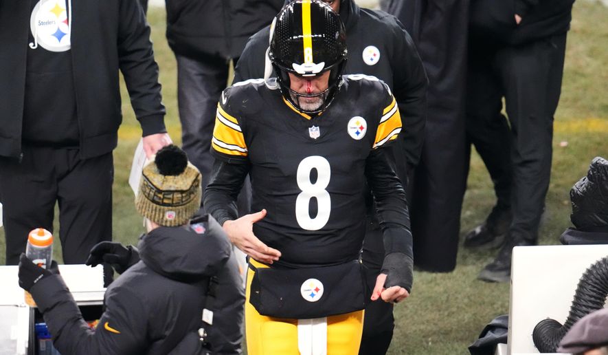Pittsburgh Steelers quarterback Aaron Rodgers (8) walks to the sideline to be check out for injury during the second half of an NFL football game against the Buffalo Bills Sunday, Nov. 30, 2025, in Pittsburgh. (AP Photo/Gene J. Puskar)